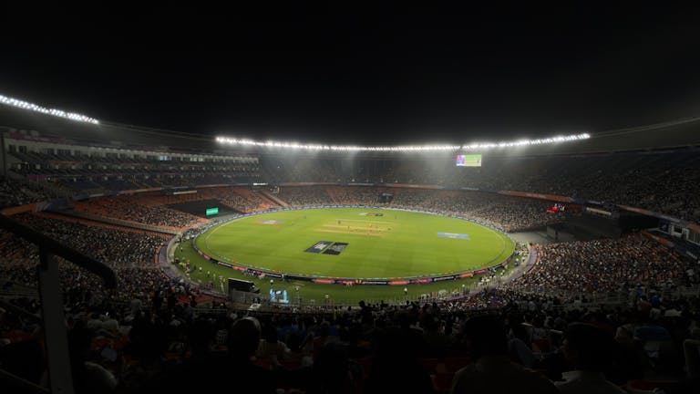 Ipl league 2026 captivating night cricket match with a large crowd at Narendra Modi Stadium in Ahmedabad, India.