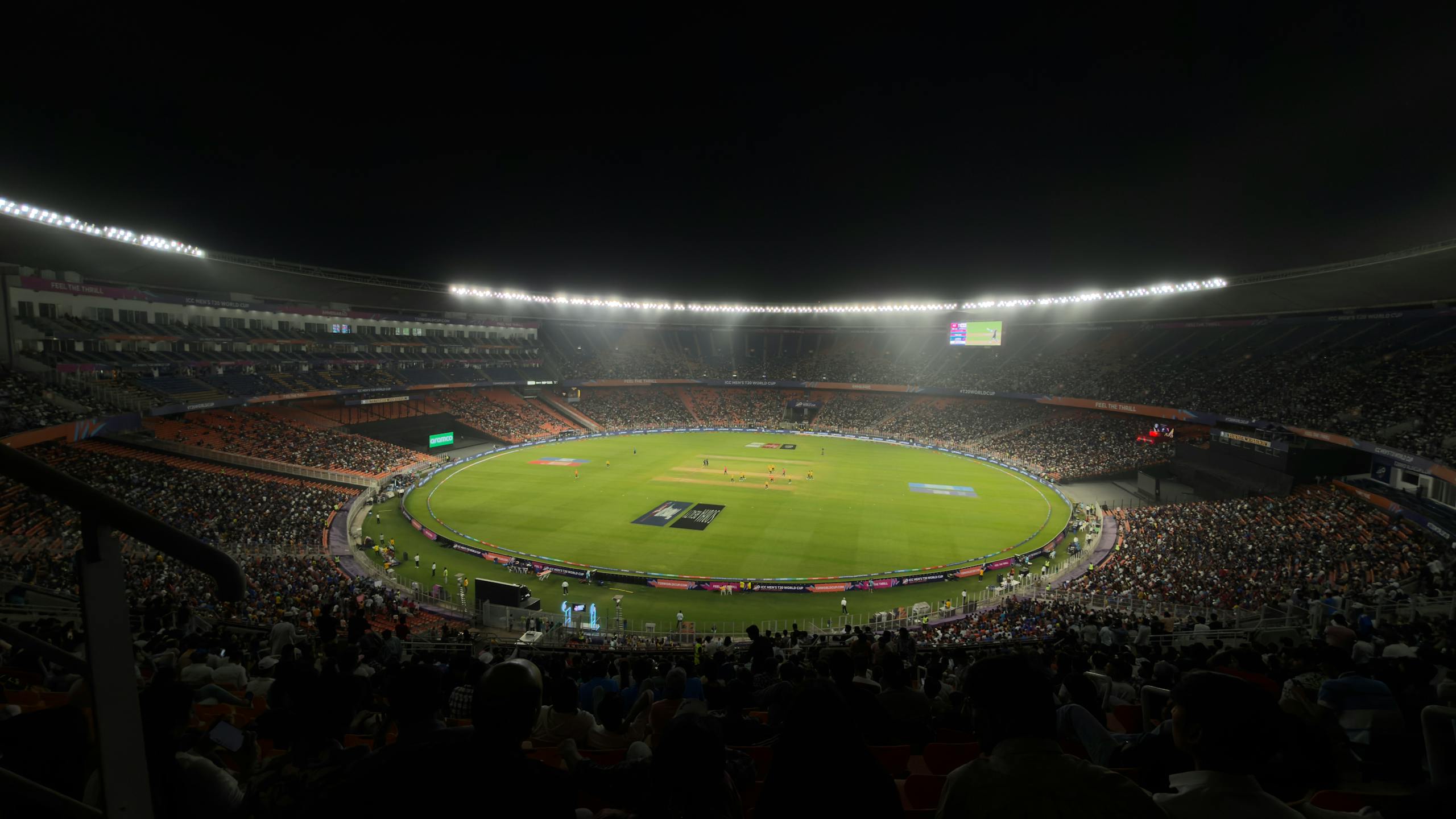Ipl league 2026 captivating night cricket match with a large crowd at Narendra Modi Stadium in Ahmedabad, India.