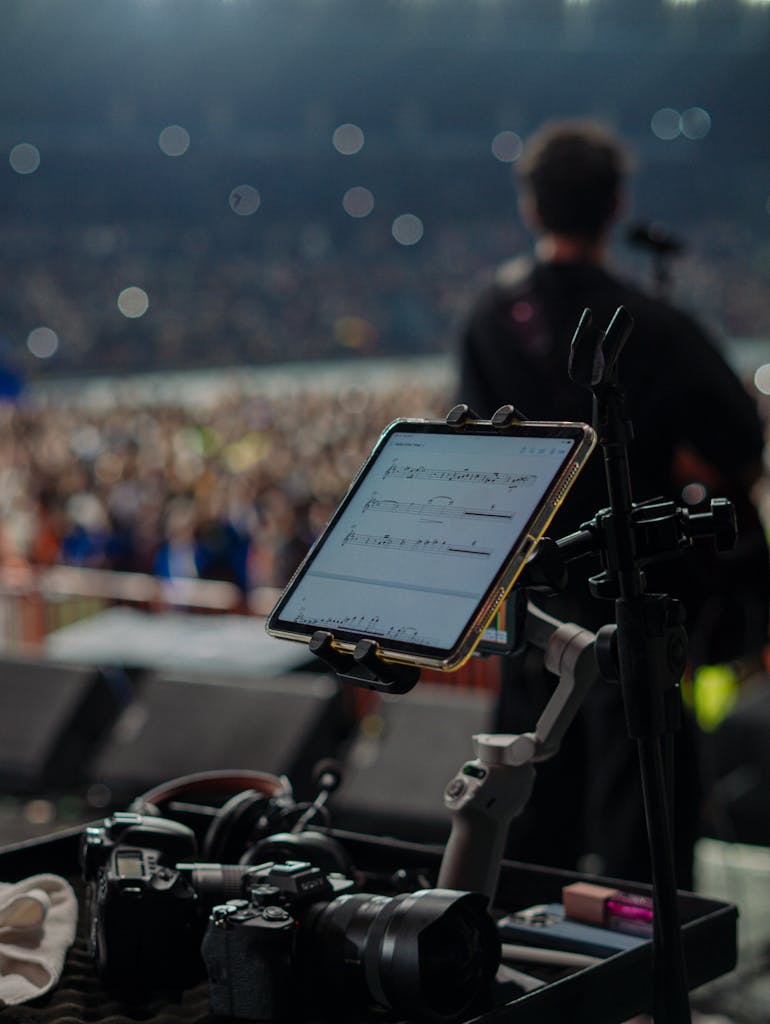 IPL 2026 Live Score   musician performing on stage with professional photography and music equipment in view.