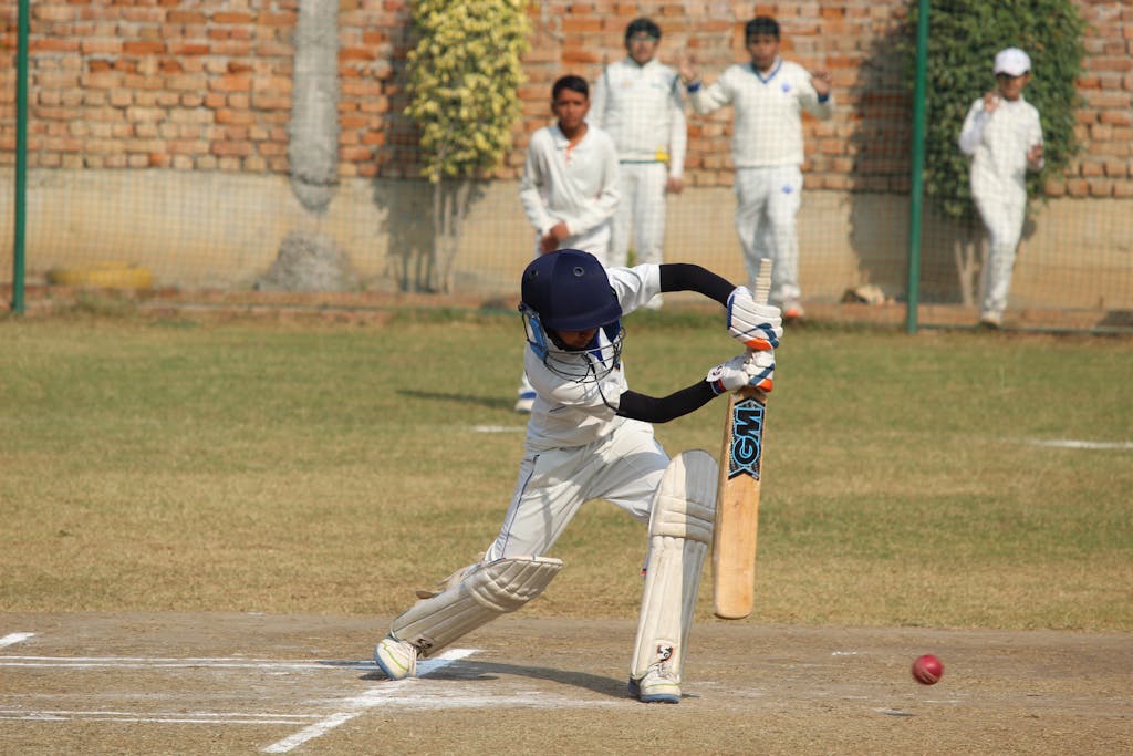 Ipl 2026 young cricket player bats during a game on a sunny day in Gurugram, India.
