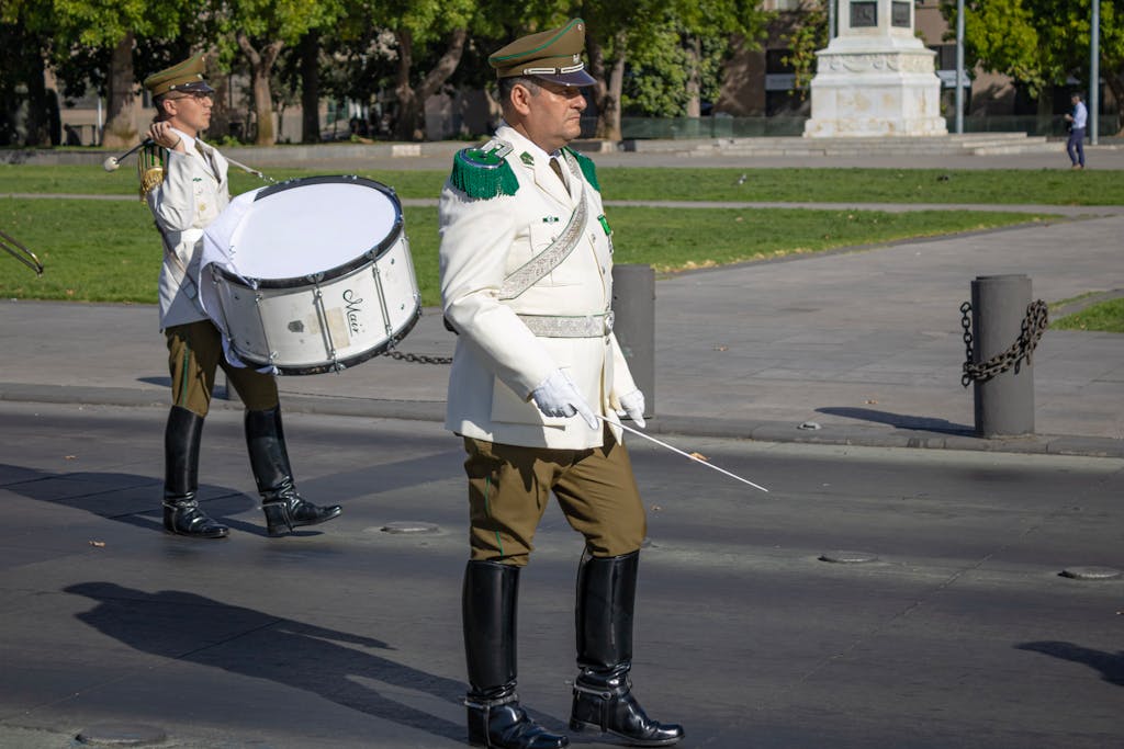 Opening Ceremony 2026 Military band marching in a ceremony at a Santiago park, Chile during the day.
