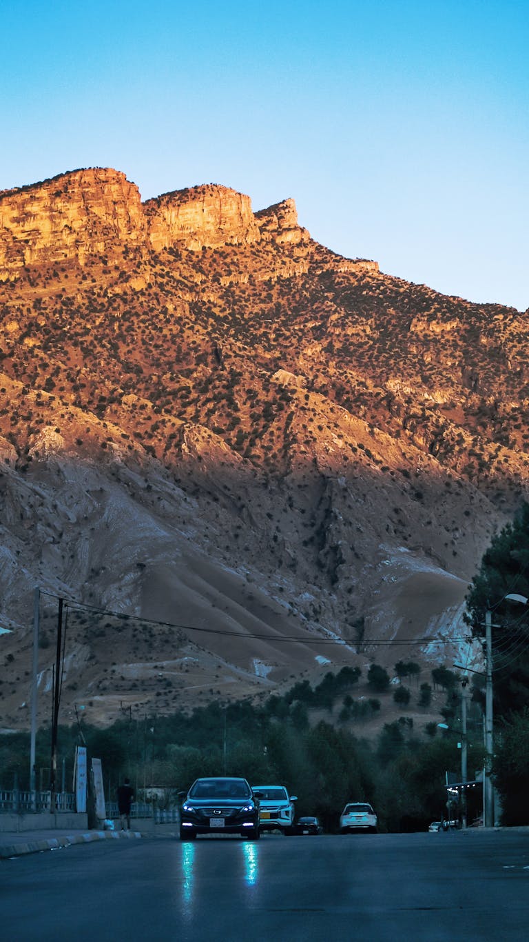 Voozon Mountain view at sunset with parked cars in the foreground. Quiet and scenic.